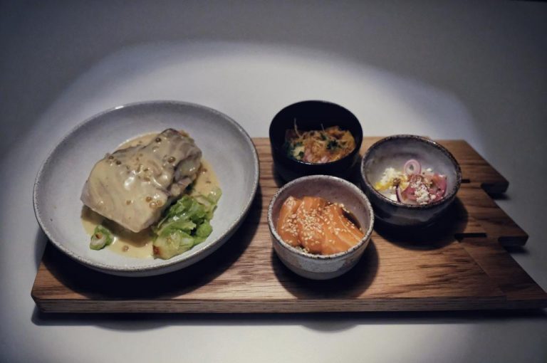 Northern lights over the water near Tromso
