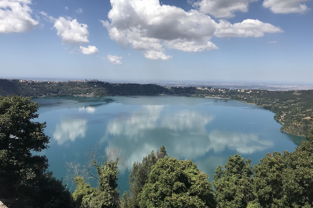 The volcanic crater lake and green hills of the Alban Hills near Rome